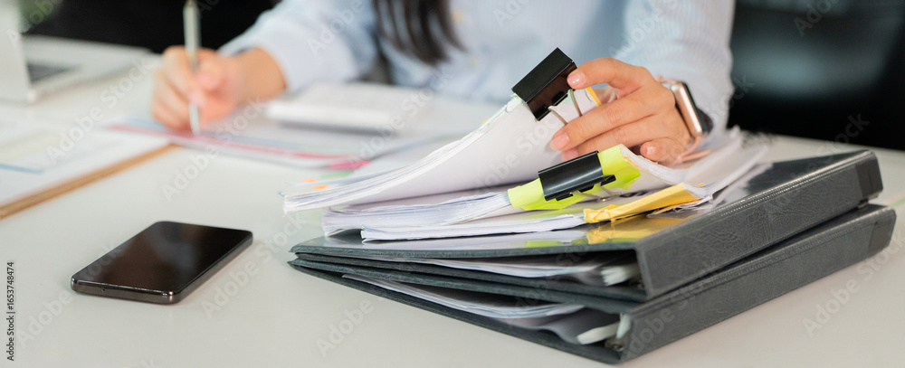 custom made wallpaper toronto digitalOrganized Workspace. Woman managing documents and files in a busy office.