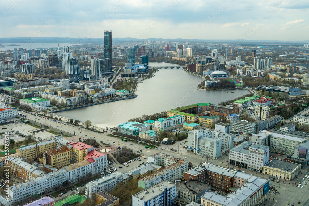 Fototapeta premium Embankment of central pond and Plotinka in Yekaterinburg at summer or early autumn . city in early autumn or summer. The historic center of the Yekaterinburg, Russia, Aerial View