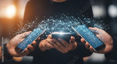 Hands holding smartphones with digital connection