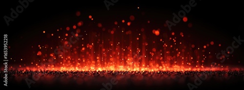 Fiery sparks rise from a dark ground