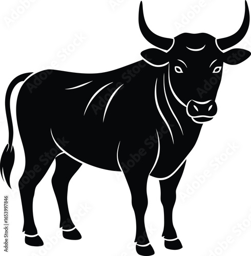 Powerful black silhouette of a standing bull with large horns