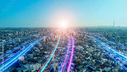 都市風景と未来へと伸びる光の帯