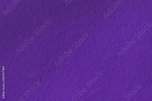 Deep purple mulberry paper with visible fiber texture. This unique, handmade background offers an artistic, organic feel for creative projects and designs.