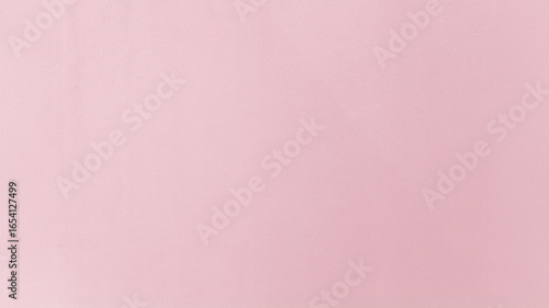 A plum painted cement wall with a subtle, rough texture. This elegant, deep-toned background is perfect for sophisticated design and photography projects.