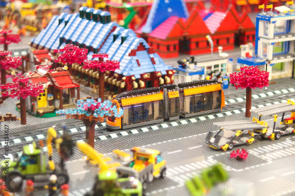 Naklejka premium Colorful lego city scene with train and buildings
