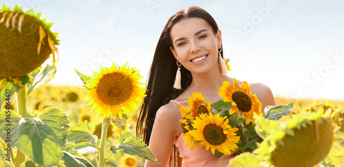 Beautiful young woman in su...