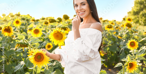 Beautiful young woman in su...