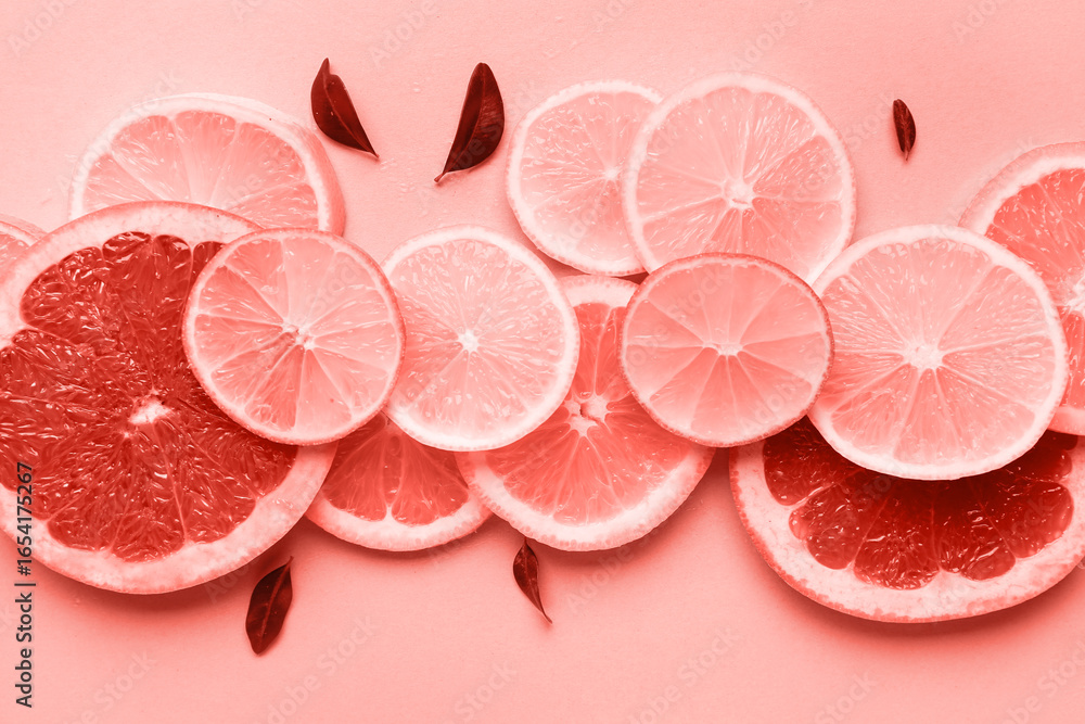 Fototapeta premium Different citrus slices and leaves on turquoise background