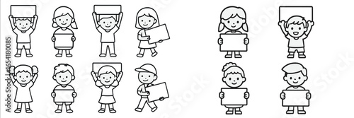 Group of children holding blank signs in a creative setting during an art activity at a community center