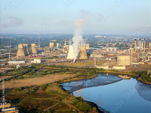 Wallpaper Mural Aerial view of the Grangemouth refinery complex, with its towering cooling towers and industrial structures, reflecting in the winding river, Grangemouth, Scotland, United Kingdom. Torontodigital.ca