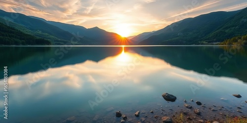 Serene mountain lake sunrise, vibrant green landscape reflected in calm water,  natural,  serenity