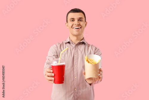 Young man with french fries...