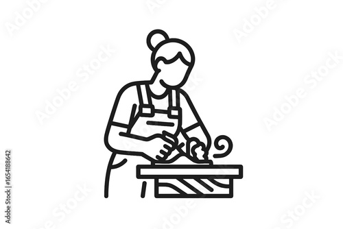 Crafting by hand in a workshop with a focus on woodworking techniques