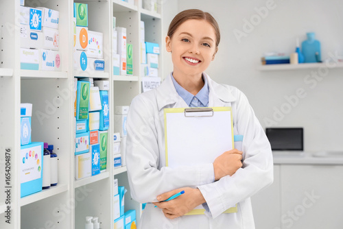 Female pharmacist with clip...