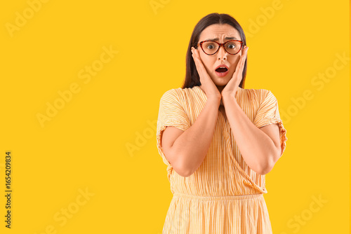 Shocked young woman in eyeg...