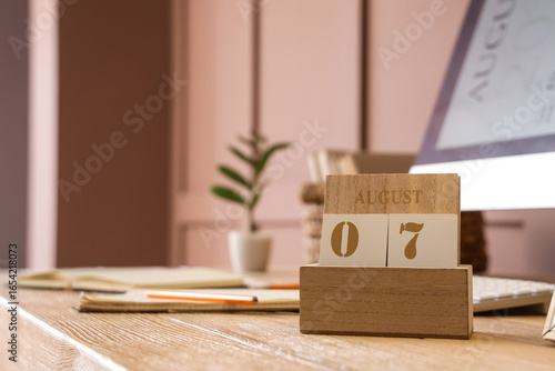 Wooden calendar with date 7...