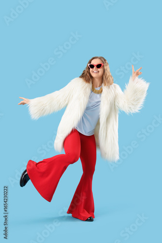 Fashionable young woman dan...