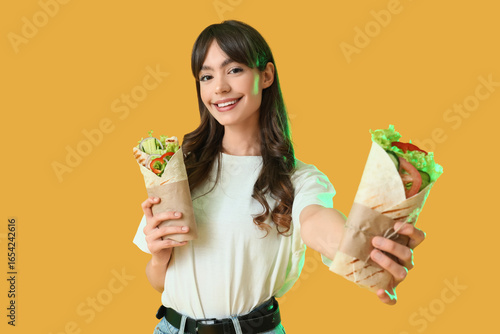 Young woman with tasty sand...