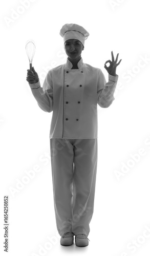 Silhouette of female chef with whisk showing OK on white background