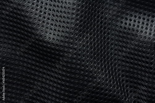 Black mesh fabric with a textured pattern in macro view, commonly used in sportswear