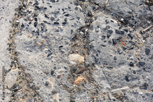Vintage aged concrete floor with texture showing effects of weather and time. Background photo. Copy Space 