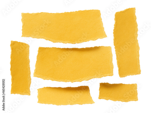 Set of yellow torn paper sheets with uneven textured edges.