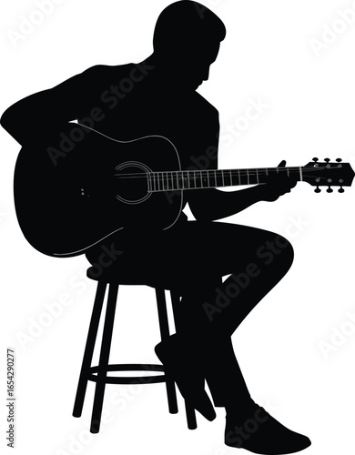 Musician playing acoustic guitar while sitting on a stool silhouette