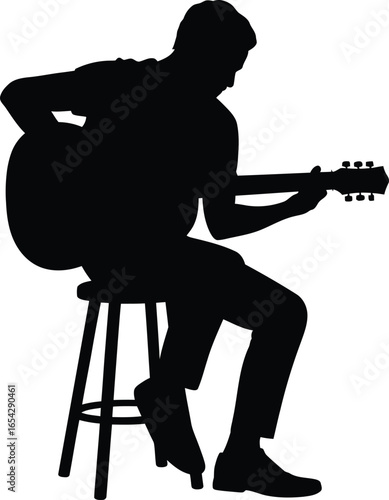 Musician playing guitar while sitting on a stool silhouette