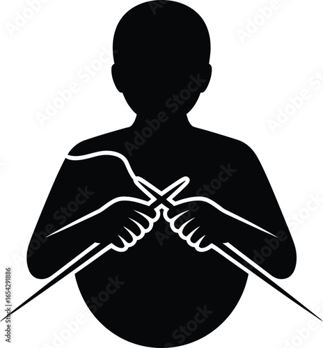 Person knitting with needles and yarn in a stark black silhouette