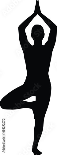Person performing tree pose yoga balancing on one leg with hands together silhouette