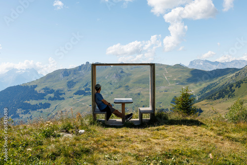 A tourist admiring the landscape in Verbier, Switzerland