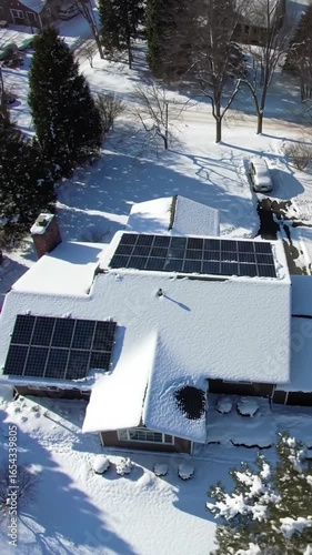 Snowy roof with solar panels