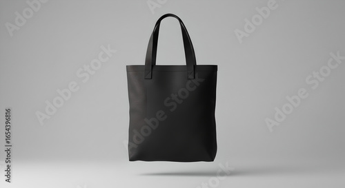 Floating black totebag mockup with blank space on a light gray background