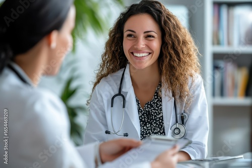 smiling woman healthcare provider explaining treatment plan.
