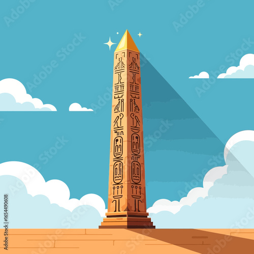 Tall ancient monument stands in a desert landscape under a blue sky.
