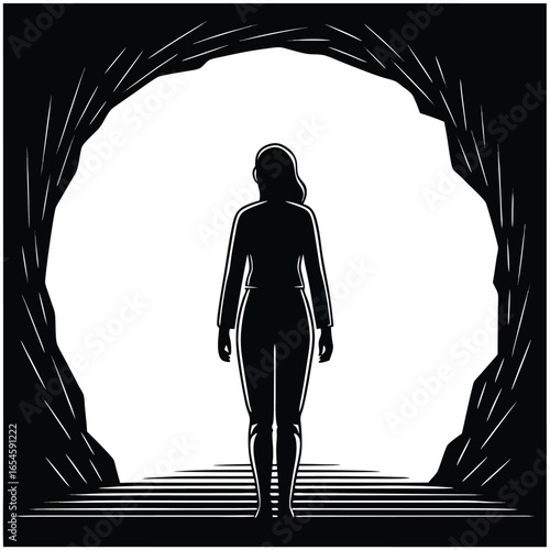 Woman hiking silhouette at cave entrance