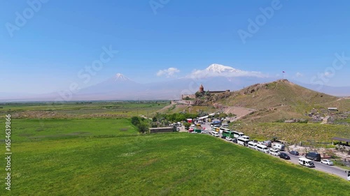 07.07.2025 Armenia Khor Virap monastery. Drone view Khor Virap monastery in Armenia, West Asia. Touristic buses, peoples near monastery. Khor Virap with Ararat mountain background.  