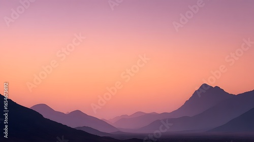 A silhouette desert mountain with soft gradient sky in orange and purple tone