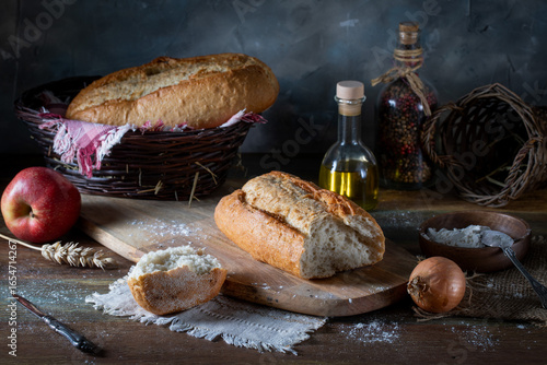 Food still life. Fresh white bread on a wooden table