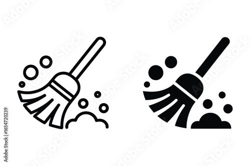 Two icons of a broom sweeping dust particles clearly representing cleaning services vector