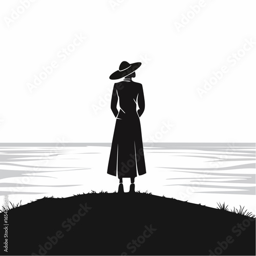 Silhouette of a Person Standing Alone on a Hill Overlooking the Ocean with a Feeling of Loneliness