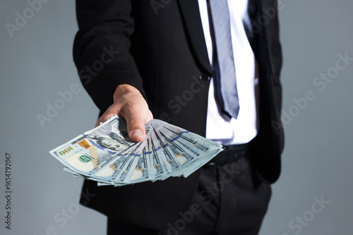 Wallpaper Mural Man with dollar bills on grey background, closeup Torontodigital.ca