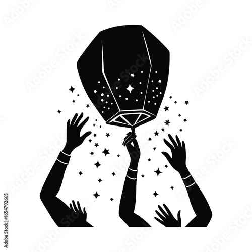 Hands releasing a sky lantern with stars