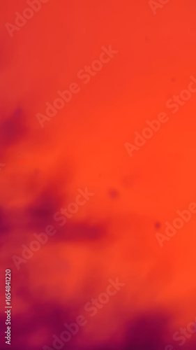 Smooth Gradient Transition From Deep Purple To Bright Orange Creating A Vibrant Abstract Background With Warm Energetic Tones.