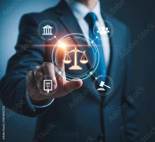 Businessman touching digital interface with legal icons representing justice and law