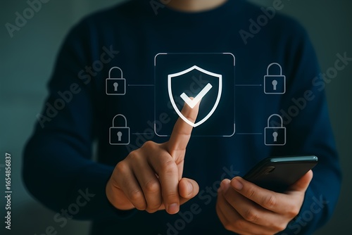 Digital Protection and Security Verification Concept – Person Using Smartphone and Pressing Shield Icon with Padlocks