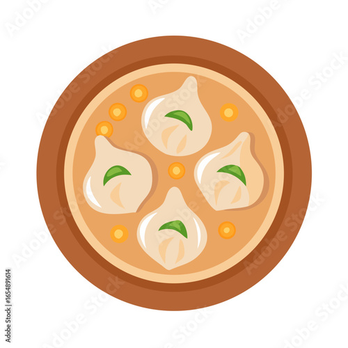 Dumplings with broth served in bowl, top view