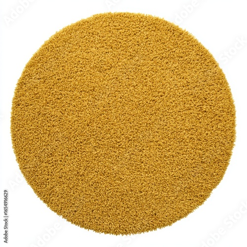 Round mustard rug on white background studio shot top down view showcasing texture and color for home decor and interior design