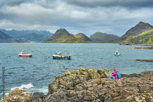 woman admiring the coastal ...