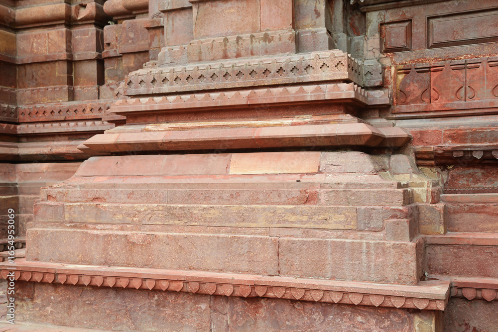 Fototapeta premium ancient Indian temple arches fragment,The sacred building carved from stone, Ancient rock curved temples of Hindu Gods at vrindavan 